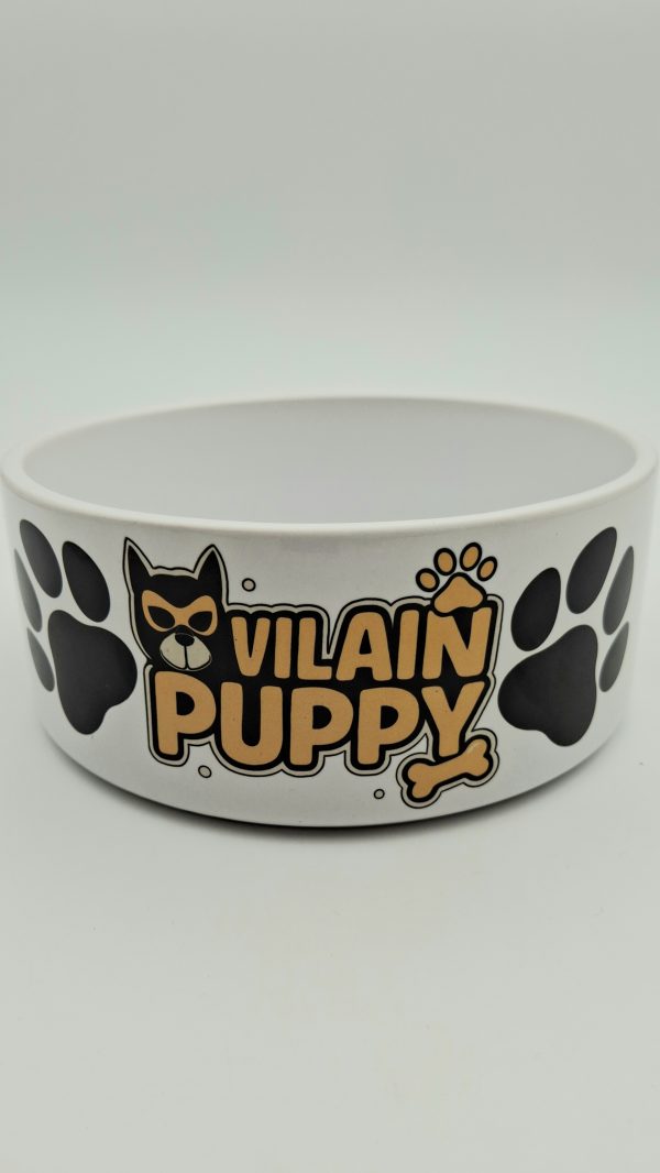 gamelle blanche en céramique avec l'inscription "vilain puppy" en noir et jaune.